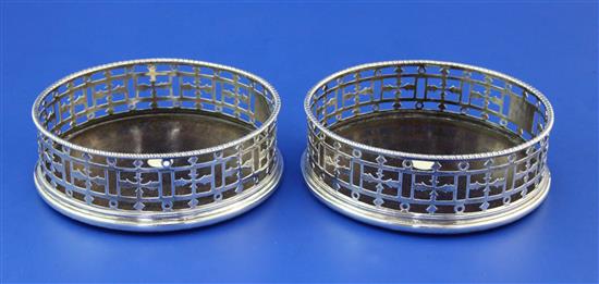 A pair of George III pierced silver wine coasters by John Weldring?, 5.25in.